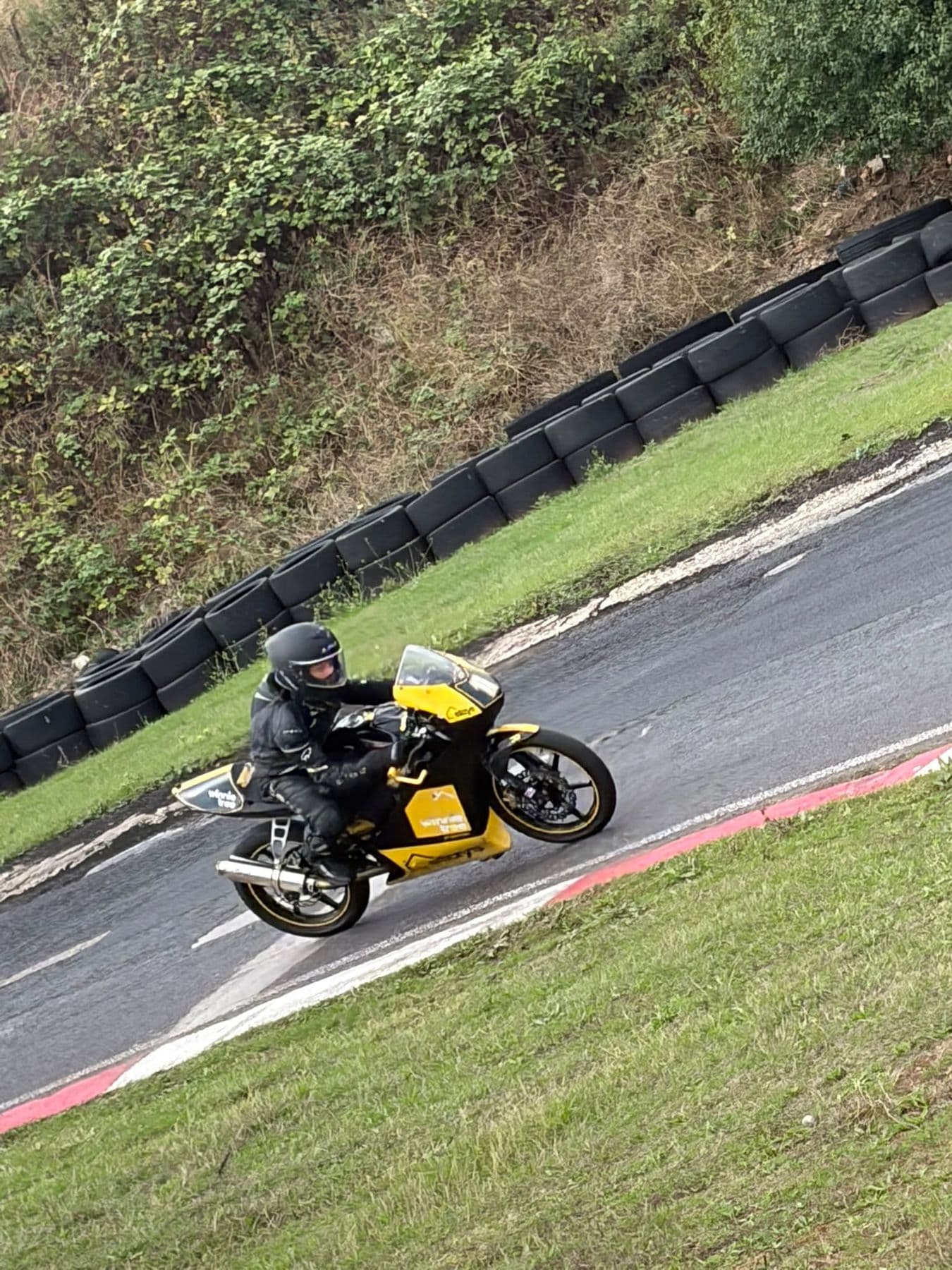 Ted riding round a banked corner