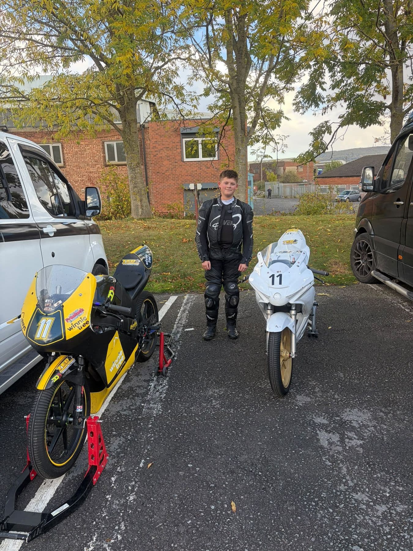 Ted between his two race bikes