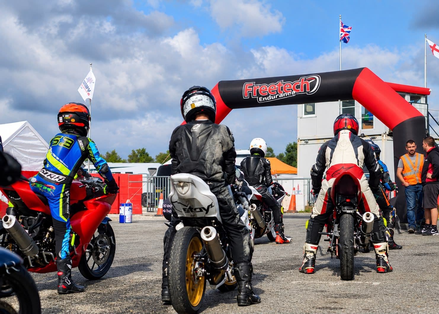 Riders gathering under the Freetech arch