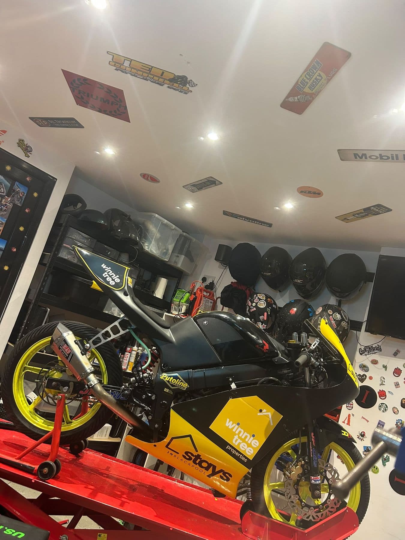 The #11 race bike on the workshop lift