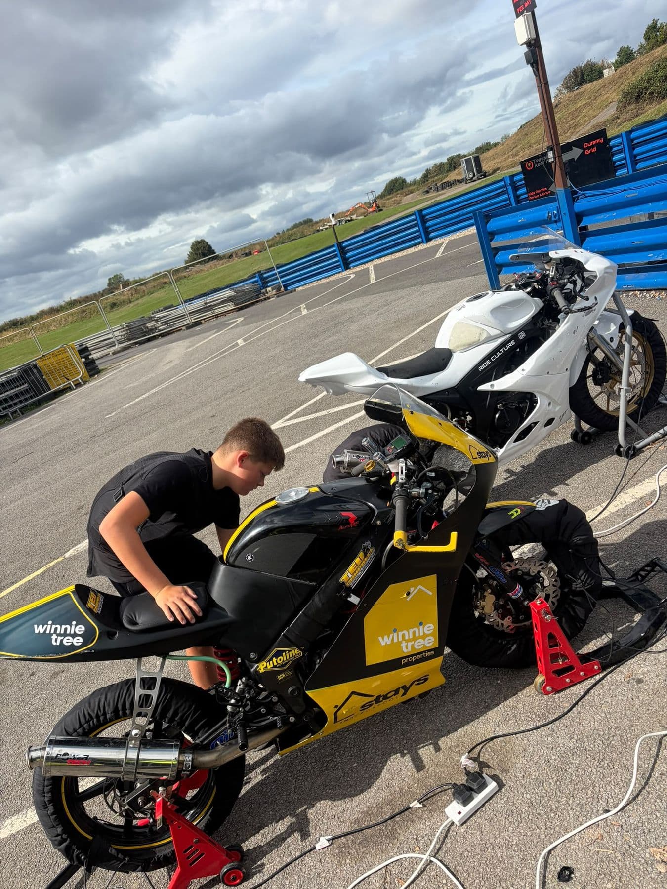 Ted working on the bike in the paddock