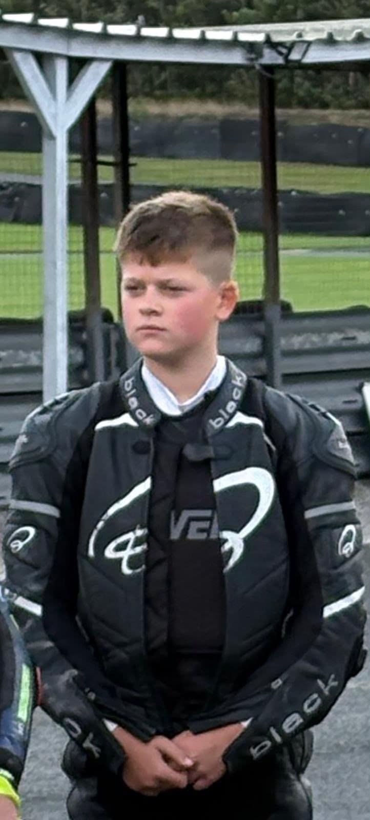 Portrait of Ted in his race leathers